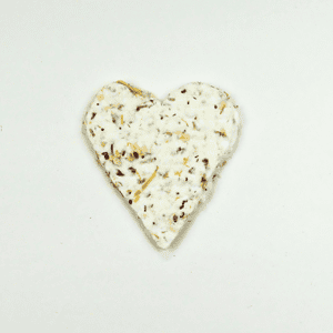 A Heart Token Urn multigrain crispbread isolated on a white background.